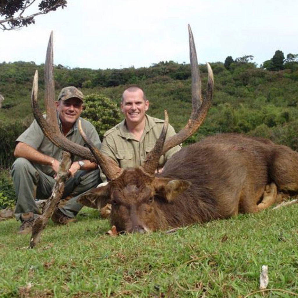 Hunter with Rusa deer trophy